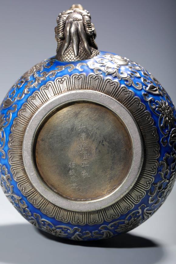 SEAVIEW AUCTIONS PTY LTDA Silver Enameled Wine Pot with Auspicious Buddhist Symbols and Dragon-Form Handle, China, 18th centuries