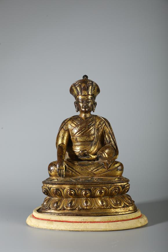 SEAVIEW AUCTIONS PTY LTDA Gilt Bronze Seated Lama Buddha Statue on Double Lotus Base, China, 18th CE