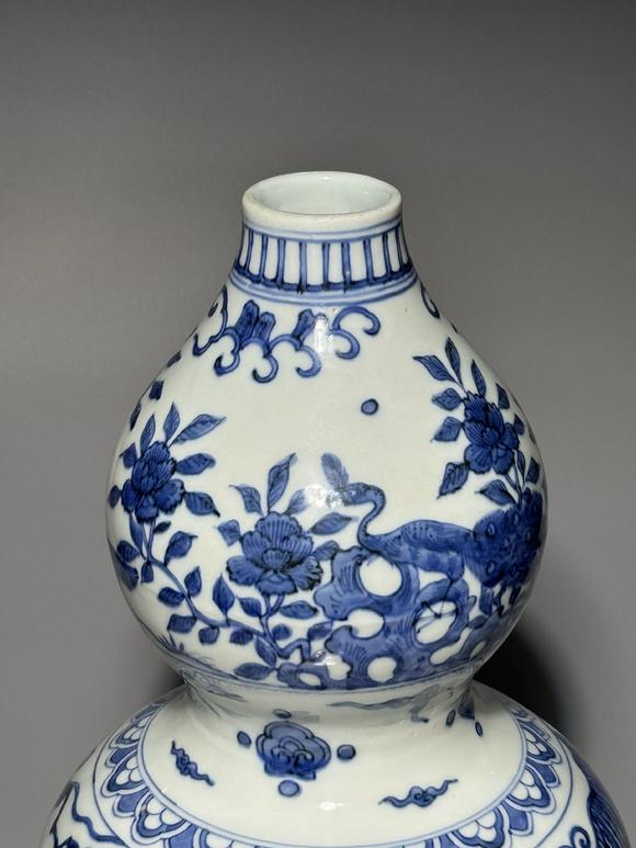 SEAVIEW AUCTIONS PTY LTDA Blue and White Double-Gourd Vase with Sages, Peacock and Floral Landscape Panels, China, 14th–17th century