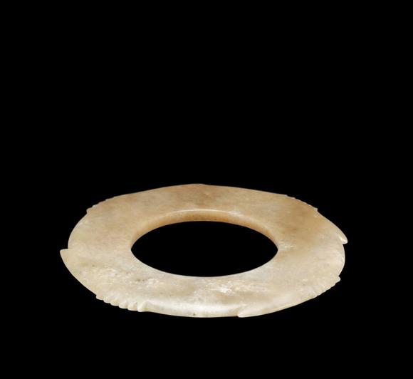 Castle AuctionA Calcified Pale Jade Notched Bi, Late Neolithic, Circa 3300–2300 C BC Pr.
