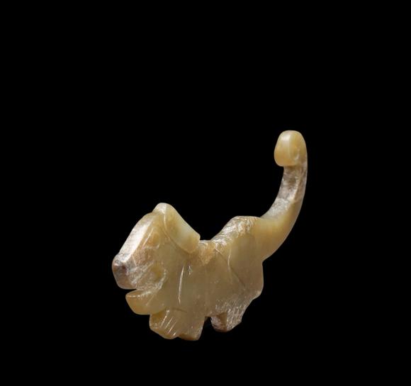 Castle AuctionA Calcified Yellow Jade Tiger-form Pendant, Western Zhou, Circa 10th–9th C BC Pr.