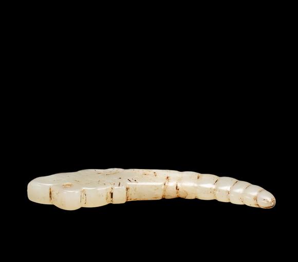 Castle AuctionA White Jade Silkworm Pendant with Russet Veins, Western Zhou, Circa 10th–8th C BC Pr.