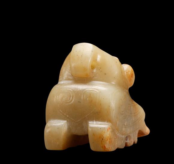 Castle AuctionA Pale Calcified Jade Recumbent Bird Carving, Late Shang, Circa 12th–11th C BC Pr.