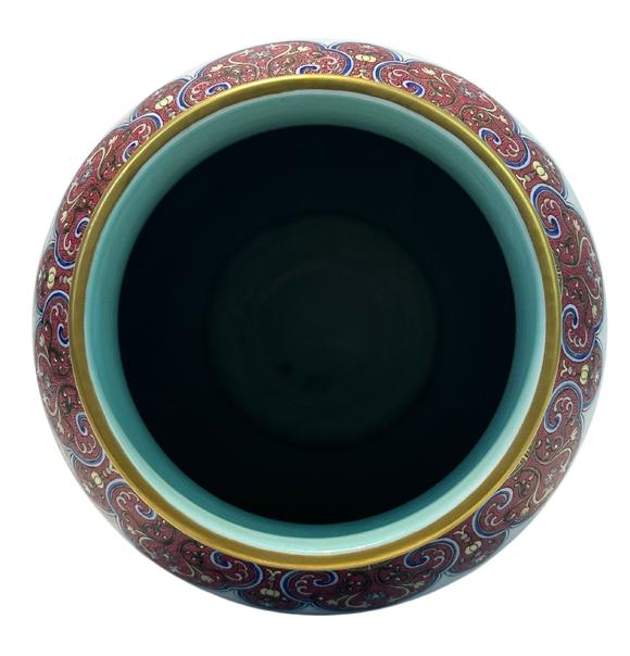 Castle AuctionA Chinese Rouge Famille Rose vase adorned with the Eight Immortals' figures pattern, together with A Chinese porcelain stand, Qian Long Pr. 