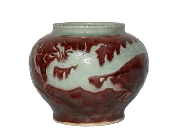Castle AuctionThe underglaze red jar with hidden dragon pattern carvings, Ming Dynasty Pr. or earlier.