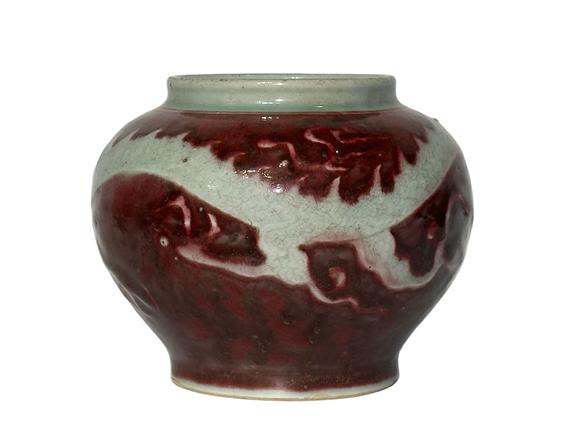 Castle AuctionThe underglaze red jar with hidden dragon pattern carvings, Ming Dynasty Pr. or earlier.