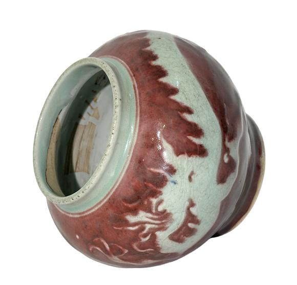 Castle AuctionThe underglaze red jar with hidden dragon pattern carvings, Ming Dynasty Pr. or earlier.