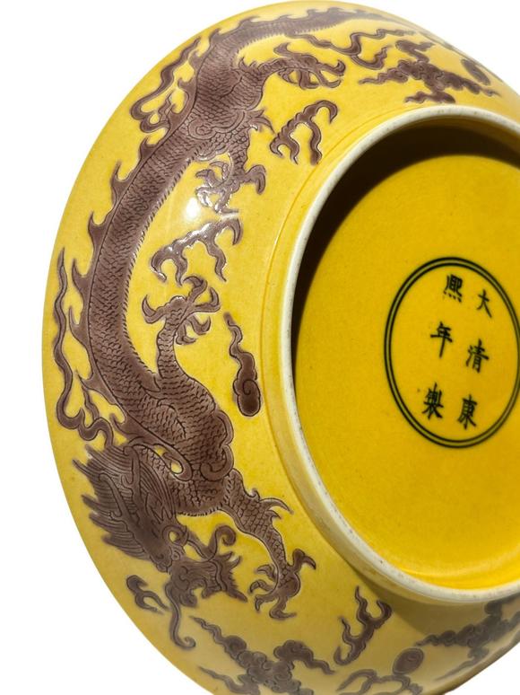 Castle AuctionYellow ground with purple dragon patterns dish, Kang Xi Pr. 
