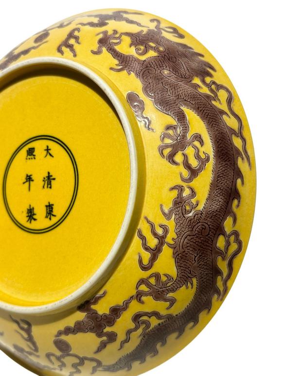 Castle AuctionYellow ground with purple dragon patterns dish, Kang Xi Pr. 
