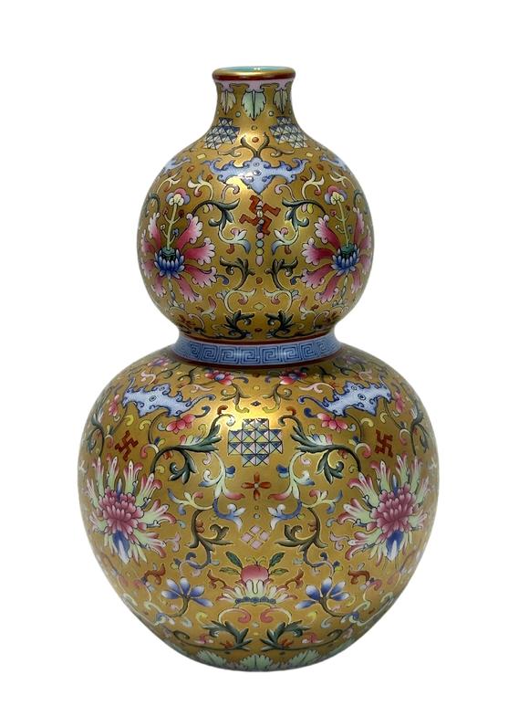 Castle AuctionA Chinese Famille Rose gilt gourd type vase, Qian Long Pr. 