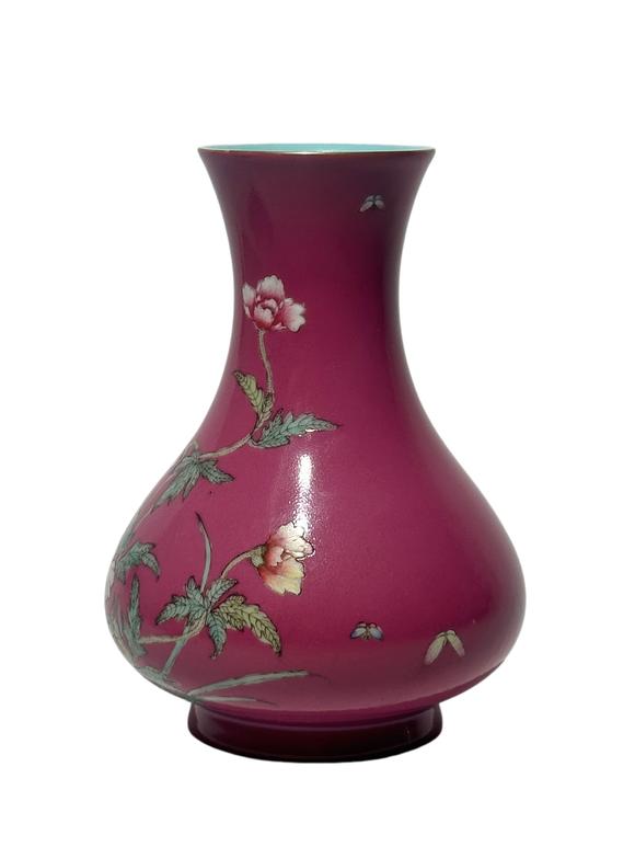 Castle AuctionA Chinese rouge-red ground famille rose vase, Qian Long Pr. 