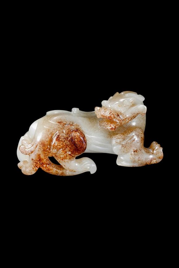 Castle AuctionA White Jade Mythical Beast Carving with Russet Inclusions, Han, Circa 2nd C BC–2nd C AD Pr.