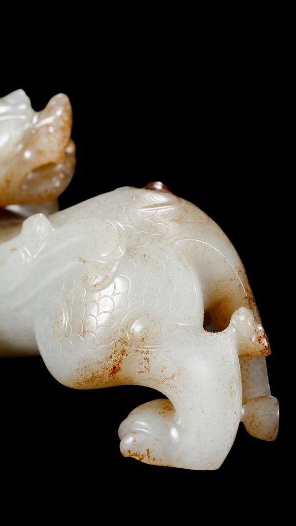 Castle AuctionA White Jade Mythical Beast Carving with Russet Inclusions, Han, Circa 2nd C BC–2nd C AD Pr.