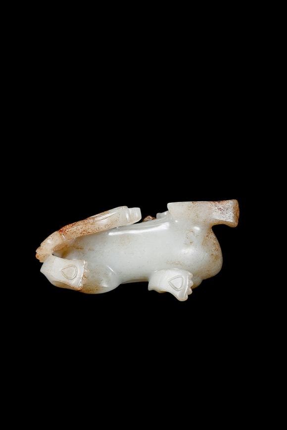 Castle AuctionA White Jade Mythical Beast Carving with Russet Inclusions, Han, Circa 2nd C BC–2nd C AD Pr.
