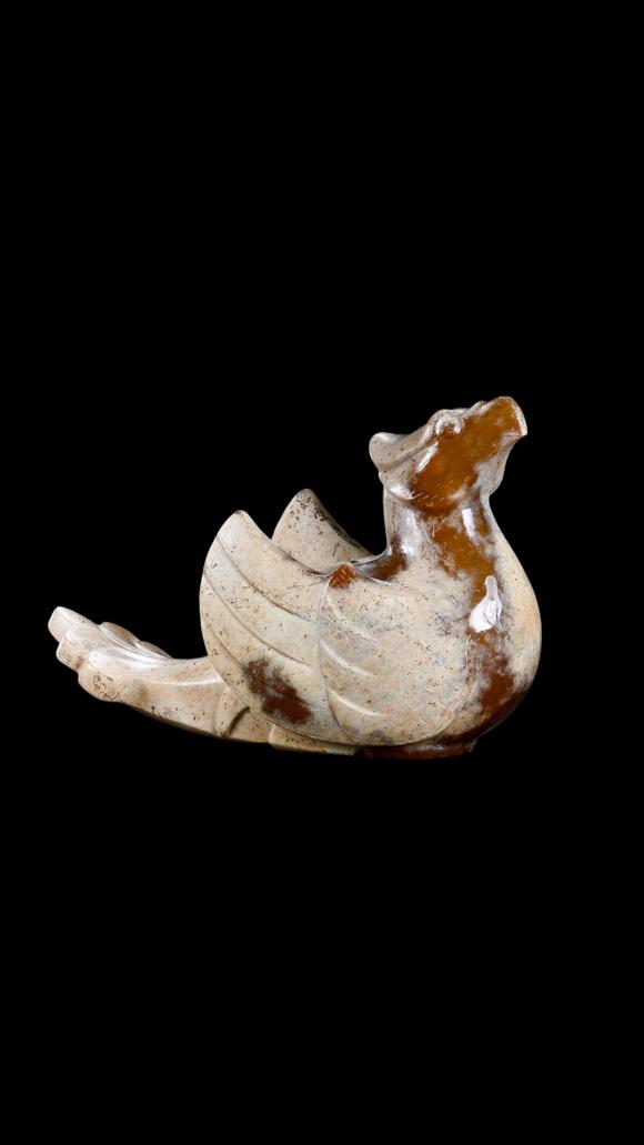 Castle AuctionA Calcified White Jade Phoenix Carving with Russet Inclusions, Han, Circa 2nd C BC–2nd C AD Pr.