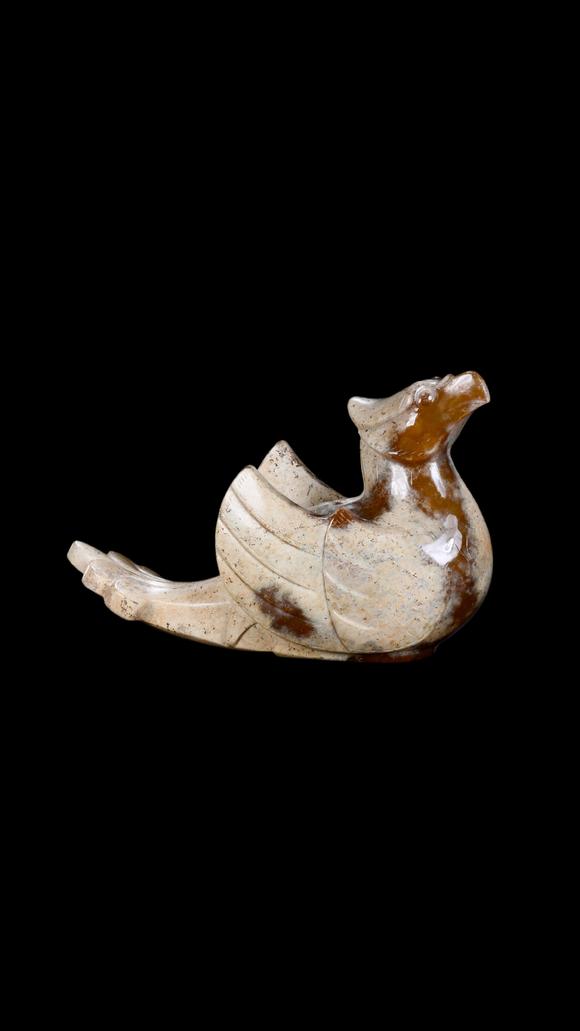Castle AuctionA Calcified White Jade Phoenix Carving with Russet Inclusions, Han, Circa 2nd C BC–2nd C AD Pr.