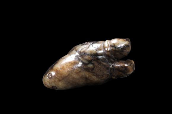 Castle AuctionA Mottled Pale Jade Ram Head Cane Finial, Han, Circa 2nd C BC–2nd C AD Pr.
