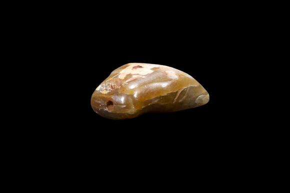 Castle AuctionA Calcified Yellow Jade Tooth-Form Pendant, Shang, Circa 13th–11th C BC Pr.
