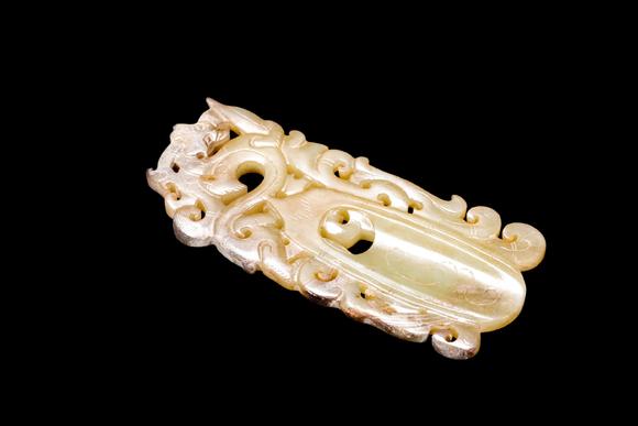 Castle AuctionA Pale Yellow Jade Openwork Dragon Phoenix Plaque, Han, Circa 2nd C BC–2nd C AD Pr.