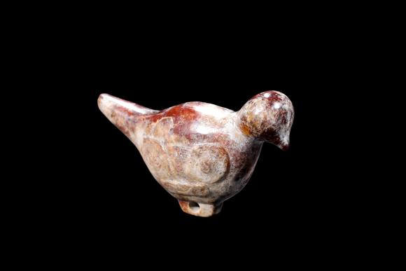 Castle AuctionA Mottled Reddish Brown Jade Bird Carving, Liangzhu, Circa 3300–2300 C BC Pr.
