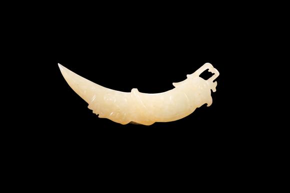 Castle AuctionA Pale Yellow Jade Phoenix Tooth Pendant, Western Zhou, Circa 10th–9th C BC Pr.