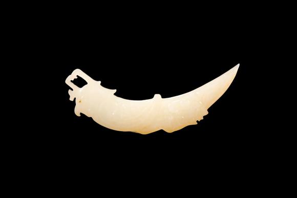 Castle AuctionA Pale Yellow Jade Phoenix Tooth Pendant, Western Zhou, Circa 10th–9th C BC Pr.