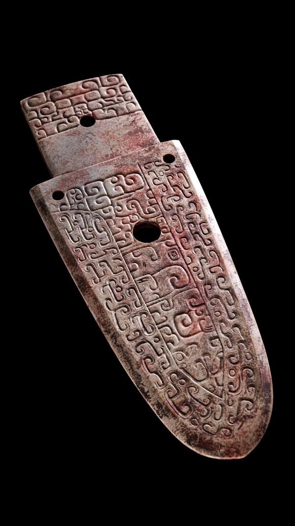 Castle AuctionA Calcified Brown Jade Carved Gui Pendant, Shang, Circa 13th–11th C BC Pr.