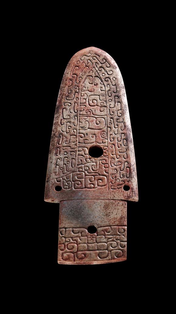 Castle AuctionA Calcified Brown Jade Carved Gui Pendant, Shang, Circa 13th–11th C BC Pr.