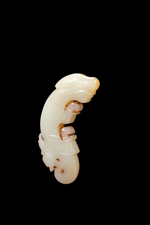 Castle AuctionA Pale Jade C-Shaped Dragon Pendant with Russet Veins, Late Shang, Circa 12th–11th C BC Pr.