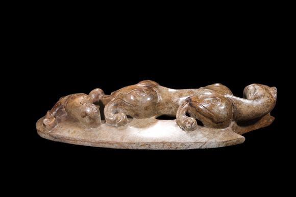 Castle AuctionA Mottled Brown Jade Double Chilong Belt Ornament, Han, Circa 2nd C BC–2nd C AD Pr.
