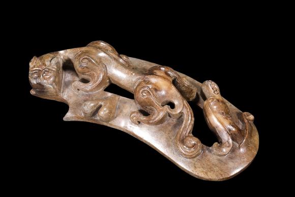 Castle AuctionA Mottled Brown Jade Double Chilong Belt Ornament, Han, Circa 2nd C BC–2nd C AD Pr.