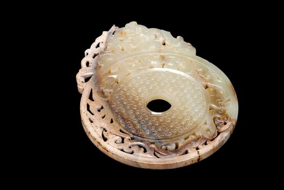 Castle AuctionA Pale Yellow Jade Openwork Dragon Phoenix Bi Disc, Han, Circa 2nd C BC–2nd C AD Pr.