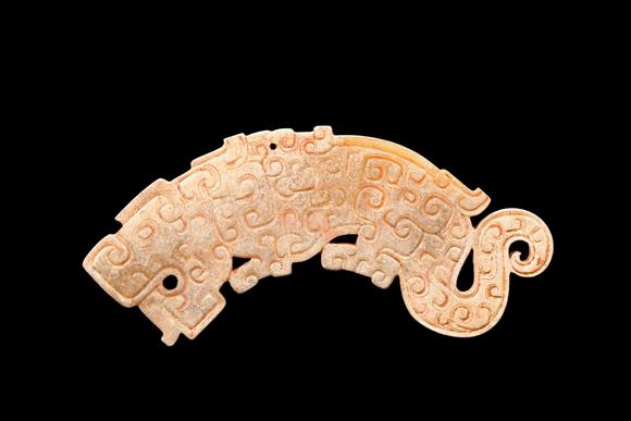 Castle AuctionA Calcified Pale Jade Tiger Plaque, Spring & Autumn, Circa 8th–5th C BC Pr.