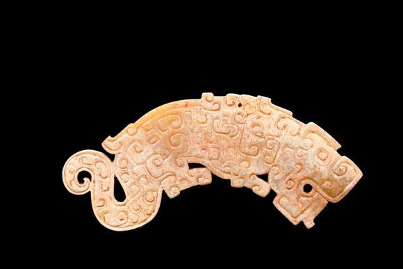 Castle AuctionA Calcified Pale Jade Tiger Plaque, Spring & Autumn, Circa 8th–5th C BC Pr.