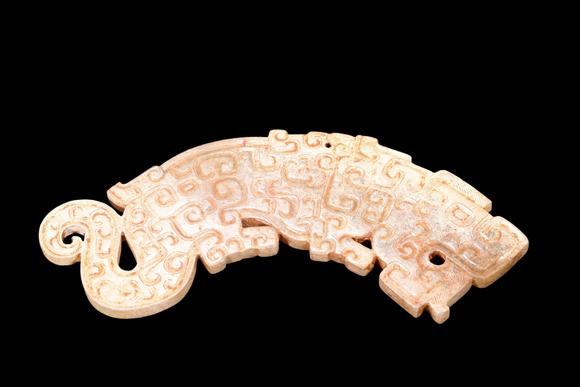 Castle AuctionA Calcified Pale Jade Tiger Plaque, Spring & Autumn, Circa 8th–5th C BC Pr.
