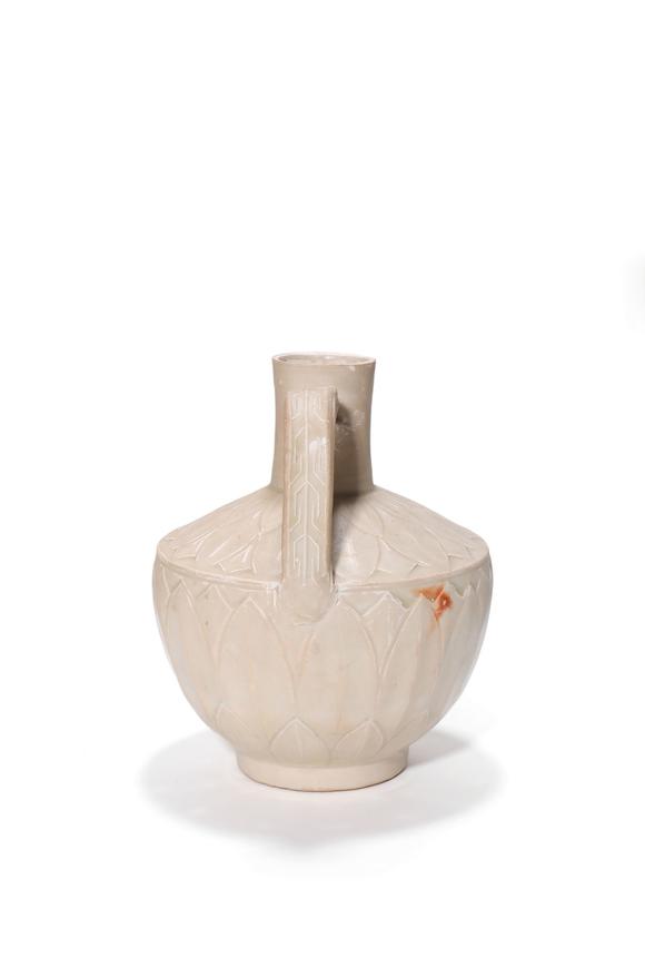 Castle AuctionA White Glaze Carved Lotus Ewer, 10th–12th C Pr.