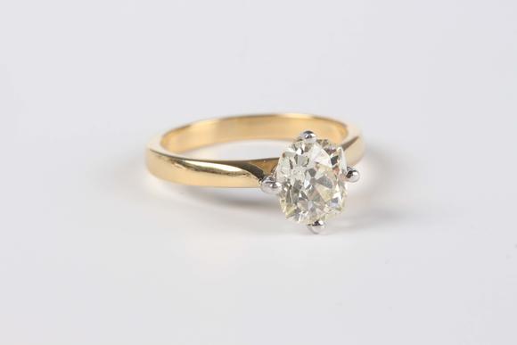 TooveysAn 18ct gold ring, claw set with an old cut cushion shaped diamond, weight 5.5g, diamond dimensions approx 7.6mm x 6.9mm, ring size approx P, with a c
