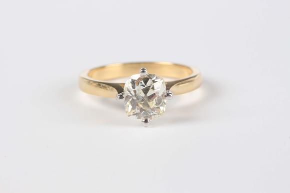 TooveysAn 18ct gold ring, claw set with an old cut cushion shaped diamond, weight 5.5g, diamond dimensions approx 7.6mm x 6.9mm, ring size approx P, with a c
