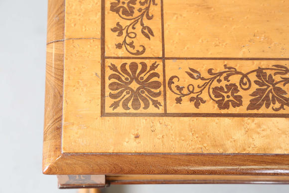 TooveysA Regency bird’s eye maple and foliate inlaid library table, in the manner of Gillows of Lancaster, the moulded top above two frieze drawers, twin su
