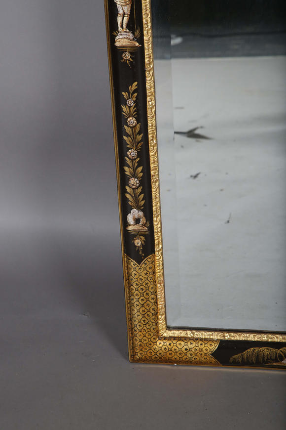 TooveysAn impressive pair of early 20th century Queen Anne style gilt and black japanned pier mirrors, each shaped crest with central shell and griffon heads