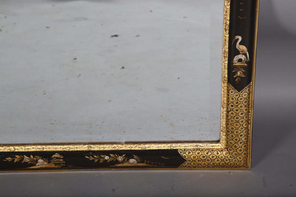 TooveysAn impressive pair of early 20th century Queen Anne style gilt and black japanned pier mirrors, each shaped crest with central shell and griffon heads