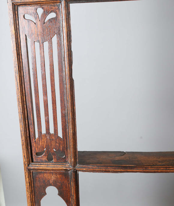 TooveysA good George III North Country oak dresser, the plate rack with pierced side panels above a lappet carved frieze and an arrangement of nine drawers,