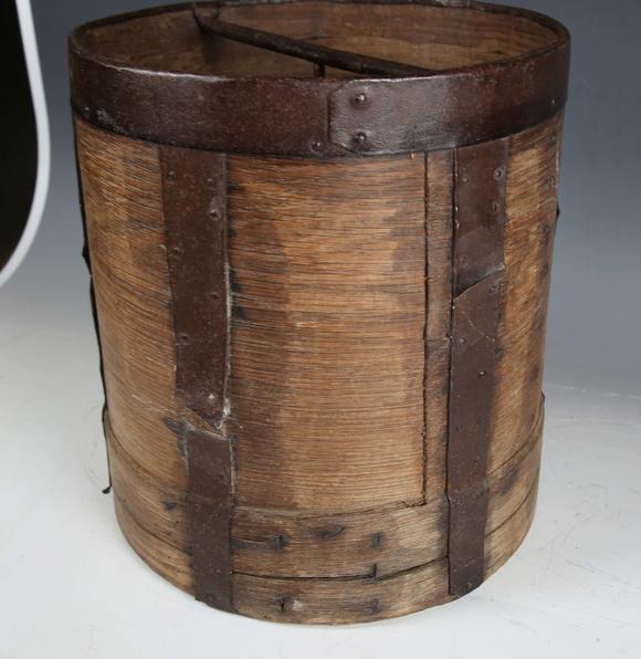 TooveysA 19th century French bentwood and metal bound grain measure, the underside stamped 'CORDIER', height 33cm, diameter 30cm.