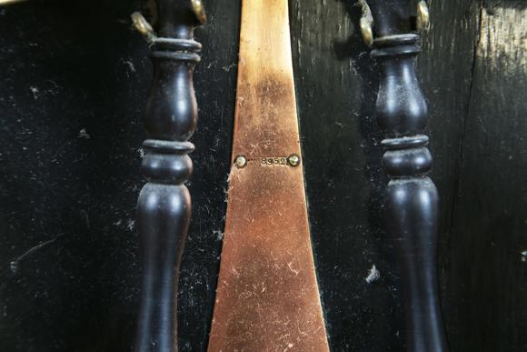 TooveysAn early 20th century copper mounted bell rack, hung with eight musical bells and two hammers, height 50cm.?Provenance: from the estate of a Sussex g