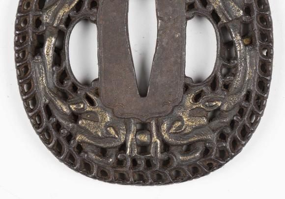 TooveysA fine Japanese oval iron tsuba, Edo period, with intricate