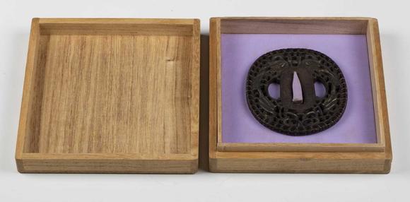 TooveysA fine Japanese oval iron tsuba, Edo period, with intricate