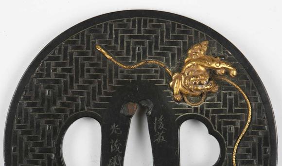 TooveysA very fine Japanese oval shakudo-inlaid bronze tsuba, Edo p