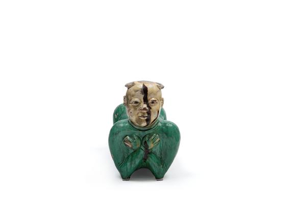 Marcopolo AuctionsPOLYCHROME SANCAI CERAMIC SCULPTURE DEPICTING A RECLINING CHILD, China, late 19th / early 20th century