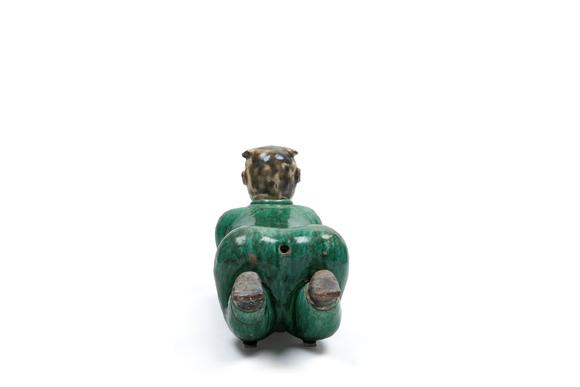 Marcopolo AuctionsPOLYCHROME SANCAI CERAMIC SCULPTURE DEPICTING A RECLINING CHILD, China, late 19th / early 20th century