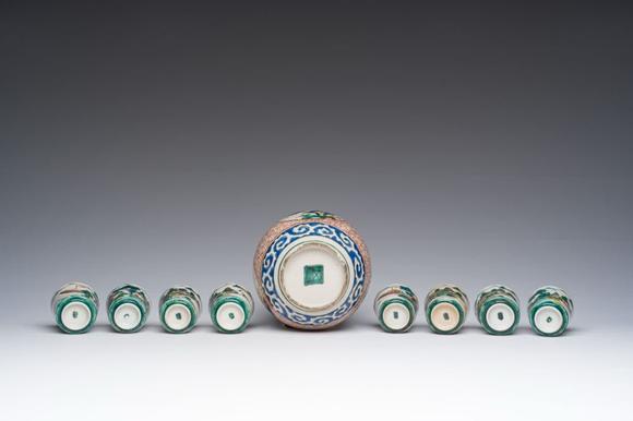 Coronari Auctions BVA Japanese Kutani 'tokuri' or sake bottle and eight cups with landscape design, Meiji, 19th C.